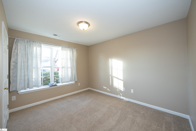 unfurnished room with carpet floors