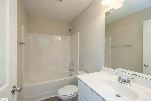 full bathroom with vanity, tub / shower combination, and toilet