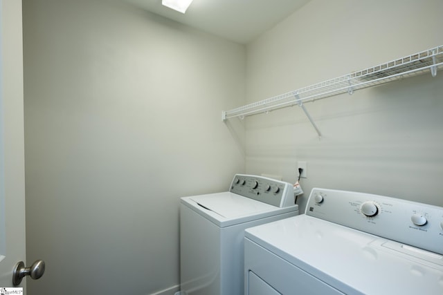 washroom with washer and clothes dryer