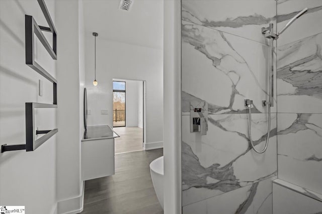 bathroom featuring tiled shower