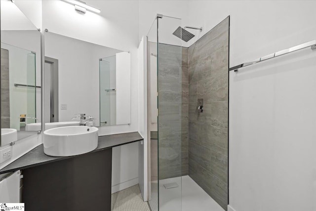 bathroom featuring vanity and a tile shower