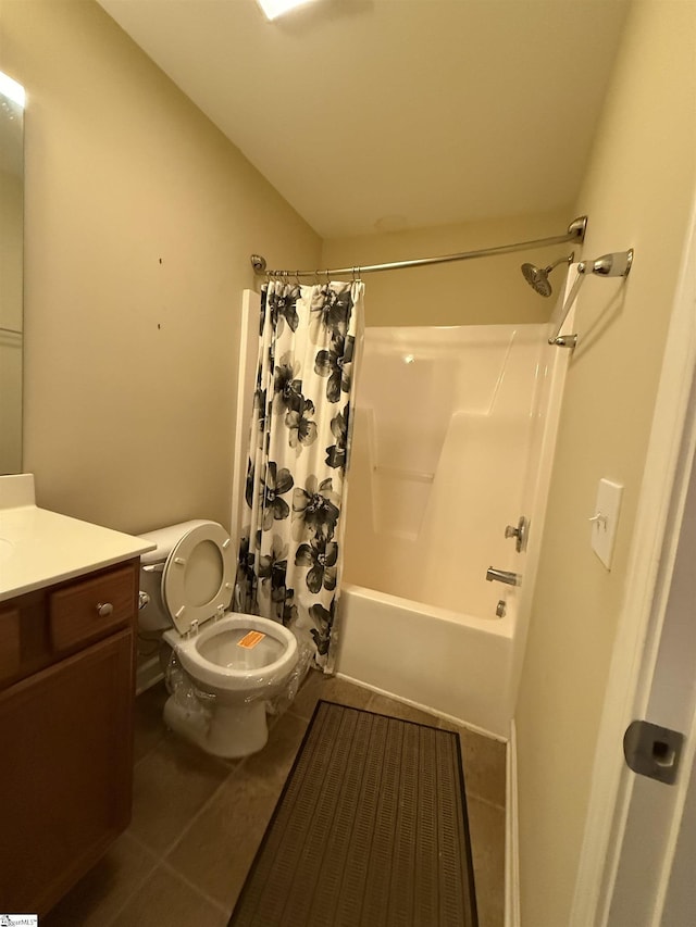 full bathroom with tile patterned floors, toilet, shower / tub combo, and vanity