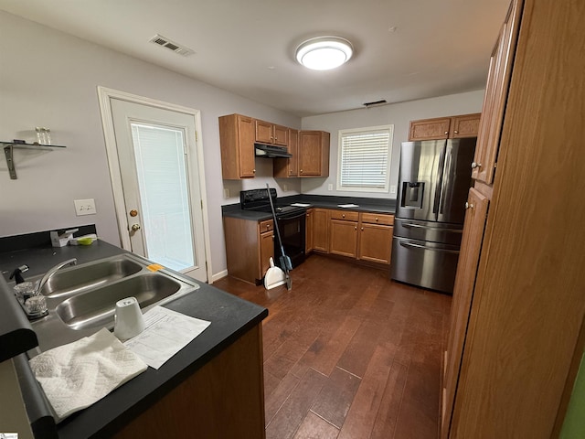 kitchen featuring stainless steel refrigerator with ice dispenser, sink, black range with electric cooktop, and dark wood-type flooring