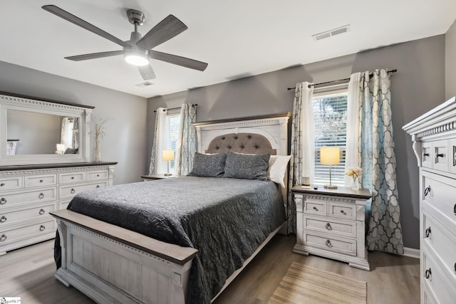 bedroom with ceiling fan and light hardwood / wood-style floors