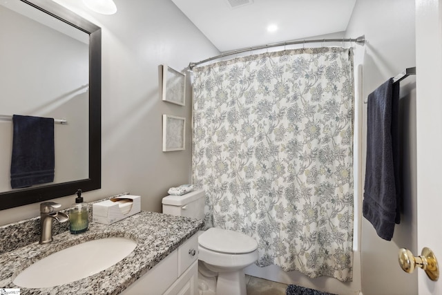 bathroom with vanity, toilet, and a shower with shower curtain