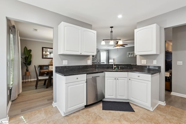 kitchen with sink, stainless steel dishwasher, kitchen peninsula, pendant lighting, and white cabinets