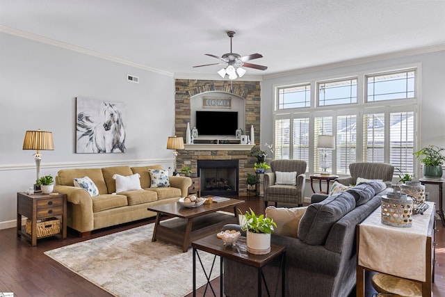 living room featuring dark wood-type flooring, plenty of natural light, and crown molding