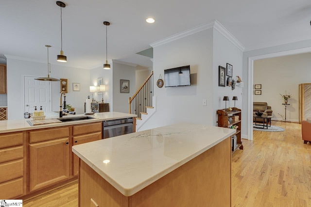 kitchen with crown molding, a center island, dishwasher, pendant lighting, and light hardwood / wood-style floors