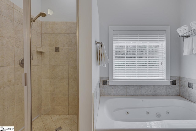 bathroom featuring shower with separate bathtub and a wealth of natural light