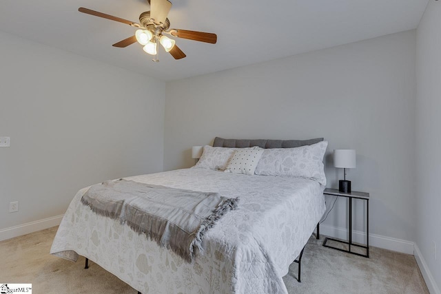 bedroom with light carpet and ceiling fan