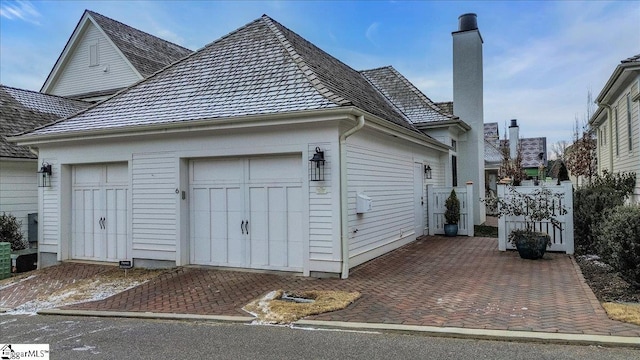 view of side of home with a garage