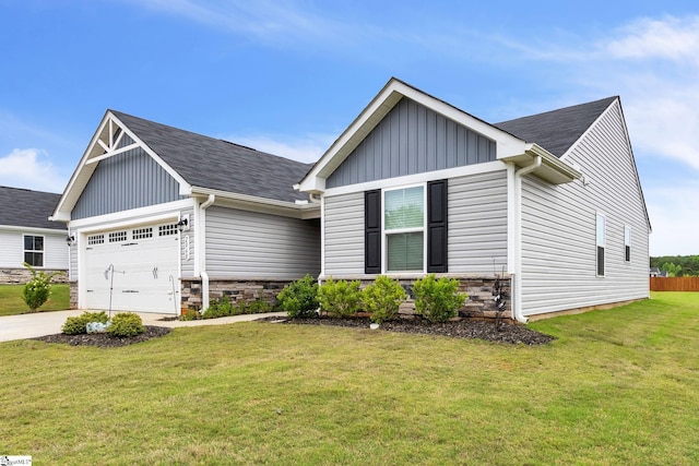 view of front of property with a garage and a front yard