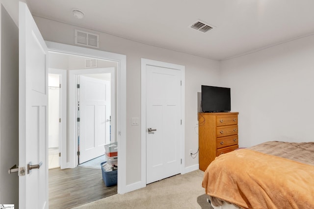 bedroom with light carpet