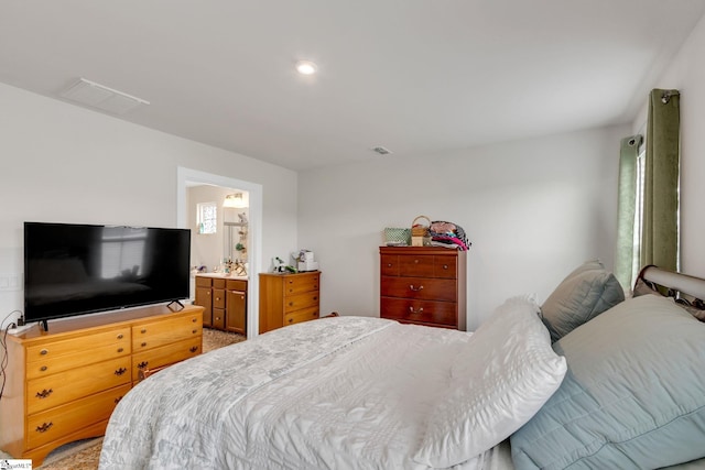 bedroom featuring ensuite bath