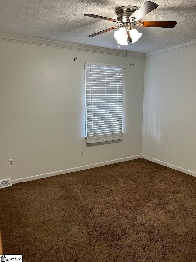 carpeted spare room featuring crown molding, ceiling fan, and a textured ceiling