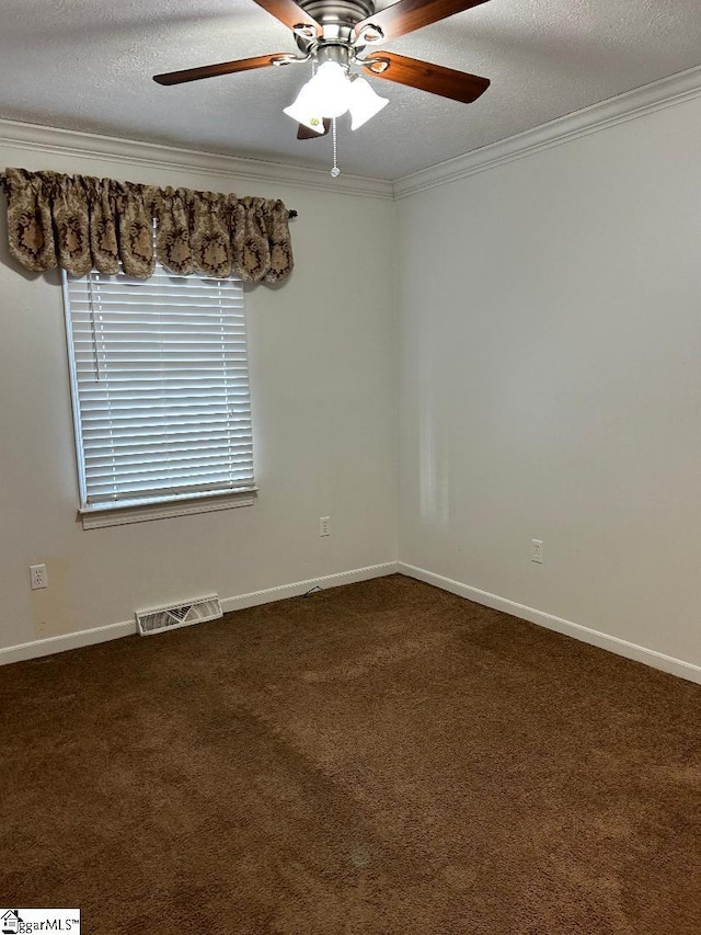 unfurnished room with ceiling fan, crown molding, a textured ceiling, and dark colored carpet