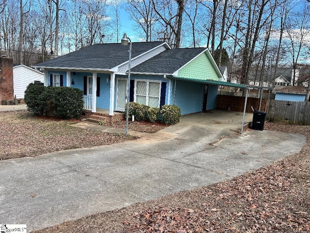 view of front of property featuring a carport