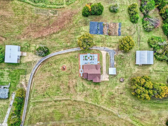 birds eye view of property featuring a rural view