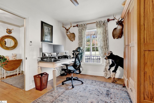 office area with wood-type flooring