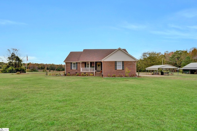 ranch-style house with a front lawn and covered porch