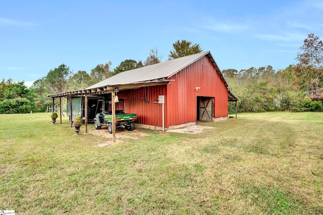 view of outdoor structure with a lawn