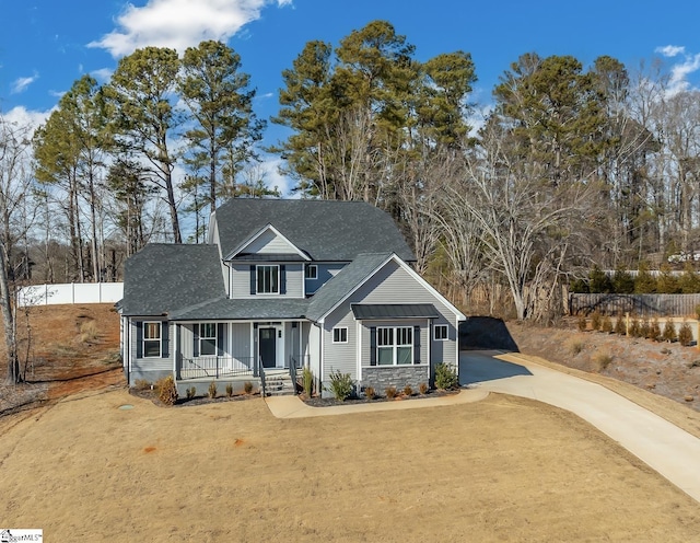 view of front of home featuring a porch and a front lawn