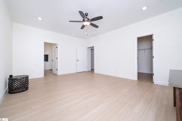 unfurnished room with light hardwood / wood-style floors and ceiling fan