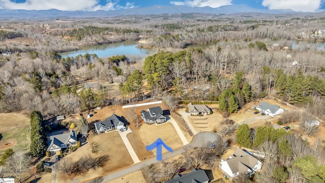 bird's eye view featuring a water and mountain view