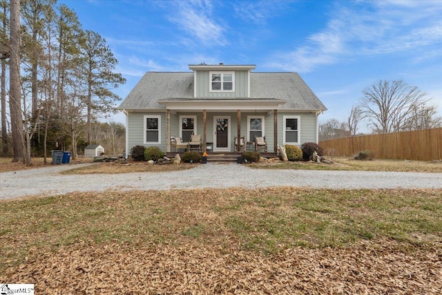 view of front of property with a front yard and covered porch