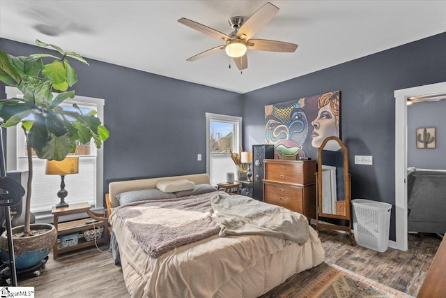 bedroom featuring hardwood / wood-style flooring and ceiling fan