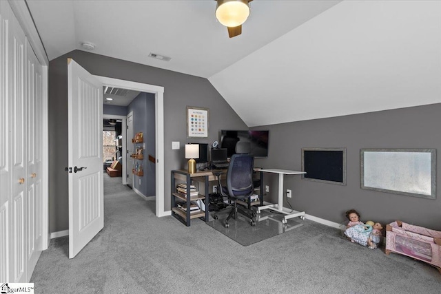 office with vaulted ceiling and carpet floors