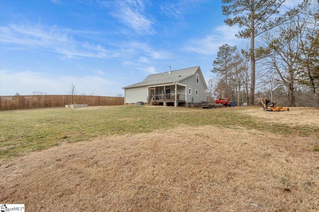 back of house with a yard