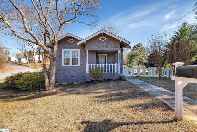 view of front of house featuring a front yard and a porch