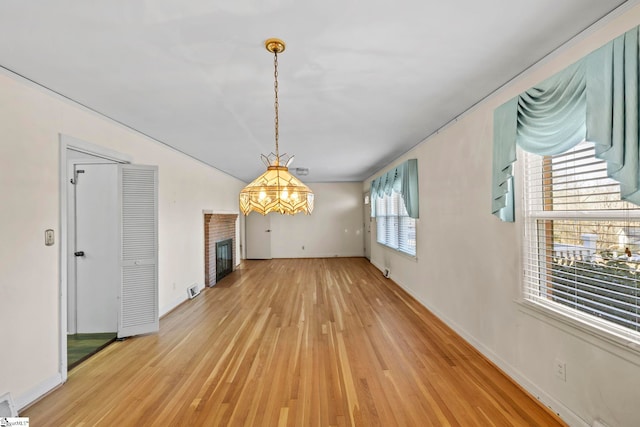 unfurnished dining area featuring hardwood / wood-style floors