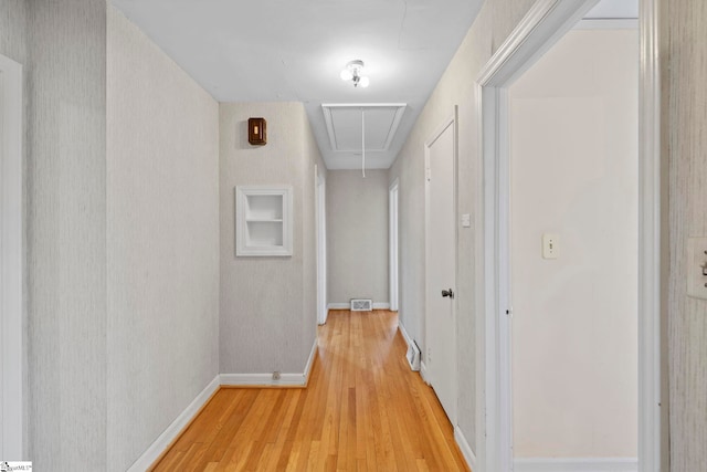 hall with light hardwood / wood-style floors