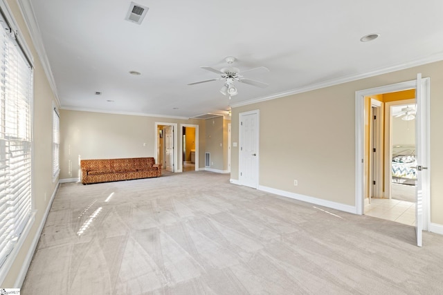 unfurnished living room with crown molding, light colored carpet, and ceiling fan