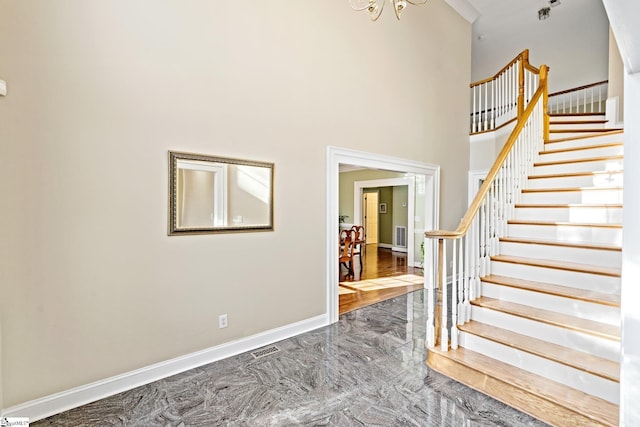 entryway with a towering ceiling