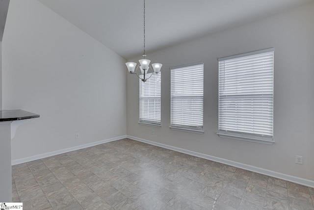 unfurnished dining area with a chandelier