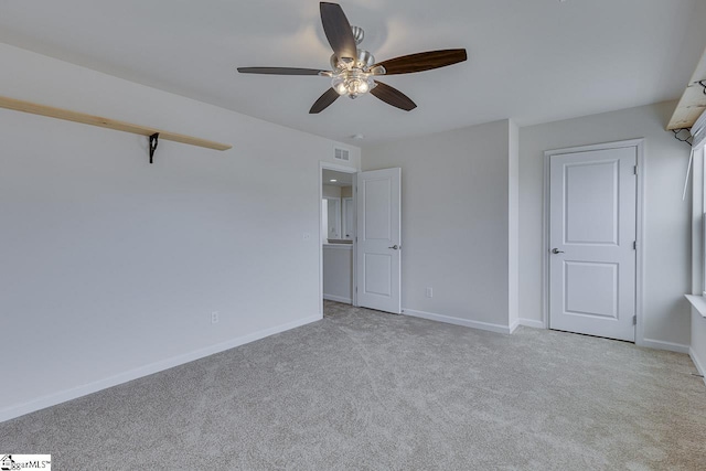 unfurnished bedroom featuring ceiling fan and light colored carpet