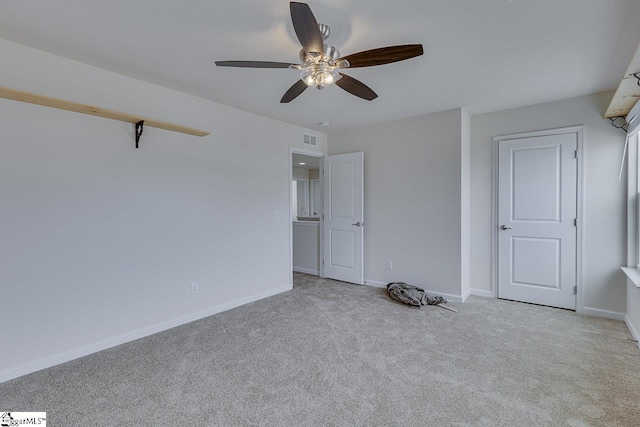 unfurnished bedroom with light colored carpet and ceiling fan