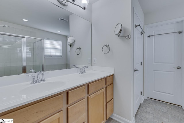 bathroom with vanity and an enclosed shower