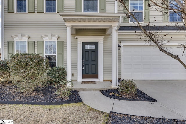 doorway to property featuring a garage