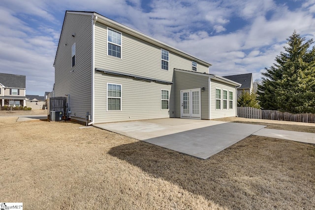 rear view of property with a patio and central AC unit