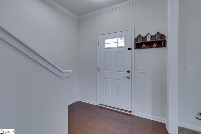 entryway with ornamental molding and dark hardwood / wood-style flooring