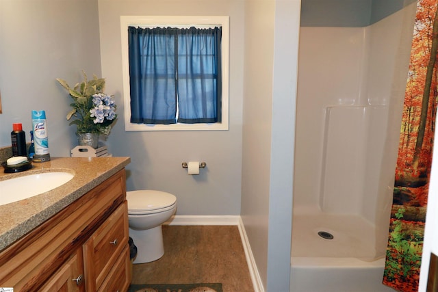 bathroom with hardwood / wood-style flooring, toilet, vanity, and walk in shower