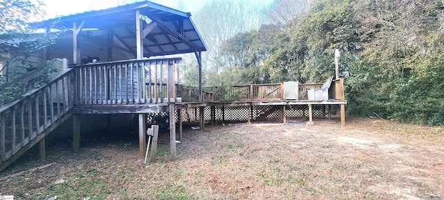 view of yard with a wooden deck