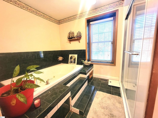 bathroom featuring independent shower and bath and tile patterned floors