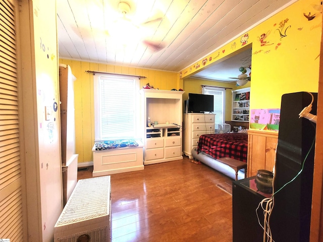 bedroom with hardwood / wood-style flooring