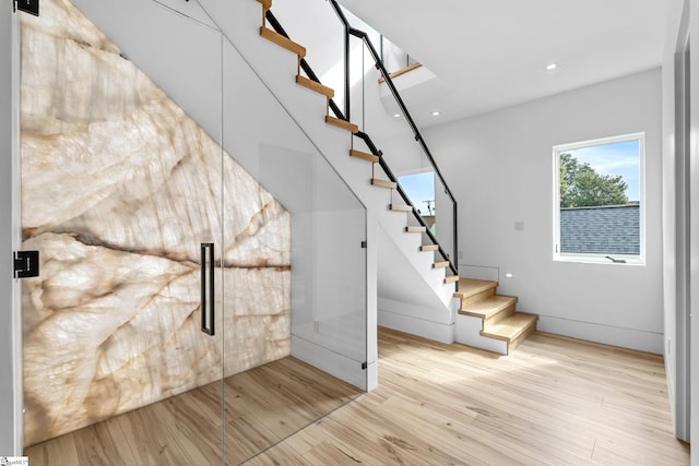 staircase featuring hardwood / wood-style flooring