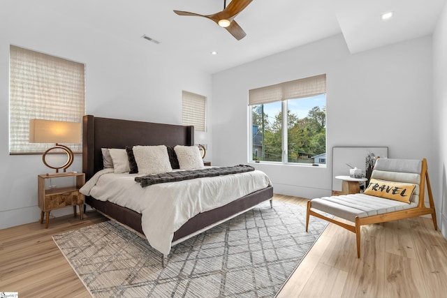 bedroom featuring light hardwood / wood-style floors and ceiling fan